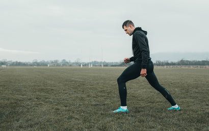 Athlete Jonny May wearing KYMIRA infrared recovery gear post-workout with DOMS relief messaging